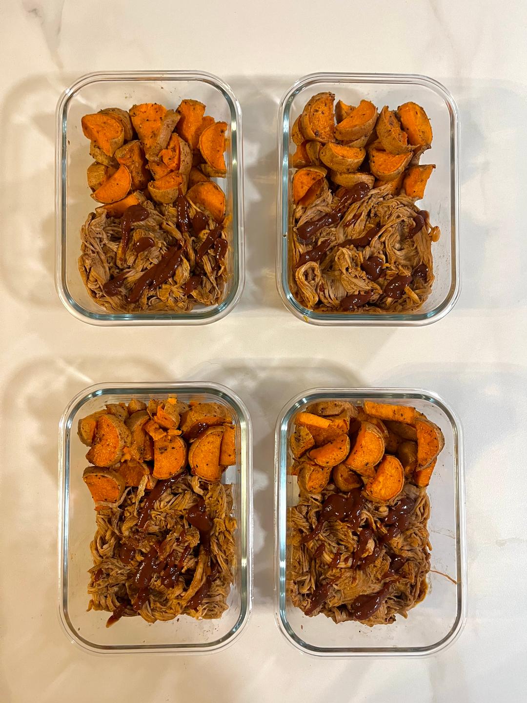 Four prepared servings of BBQ Pork & Sweet Potatoes