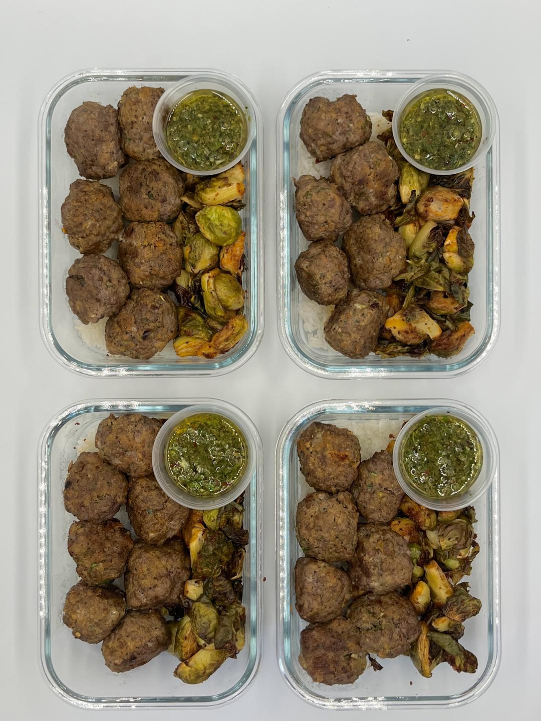 Four prepared servings of Chimichurri Pesto Meatballs