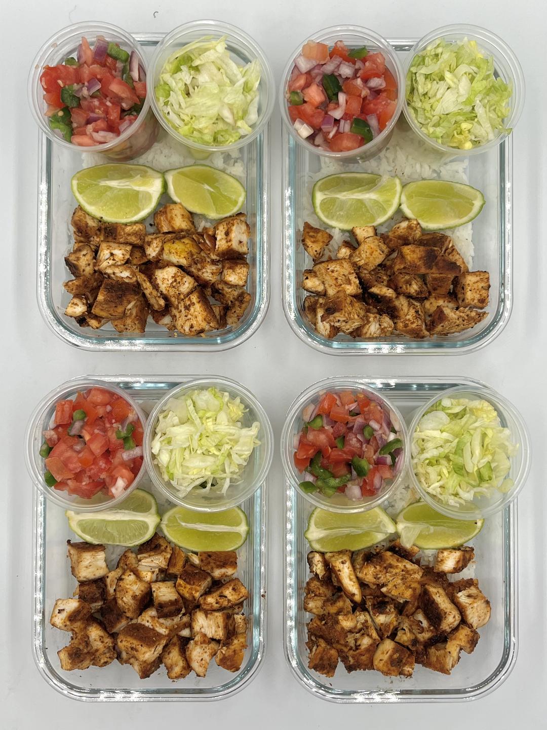 Four prepared servings of Chipotle Chicken Burrito Bowl
