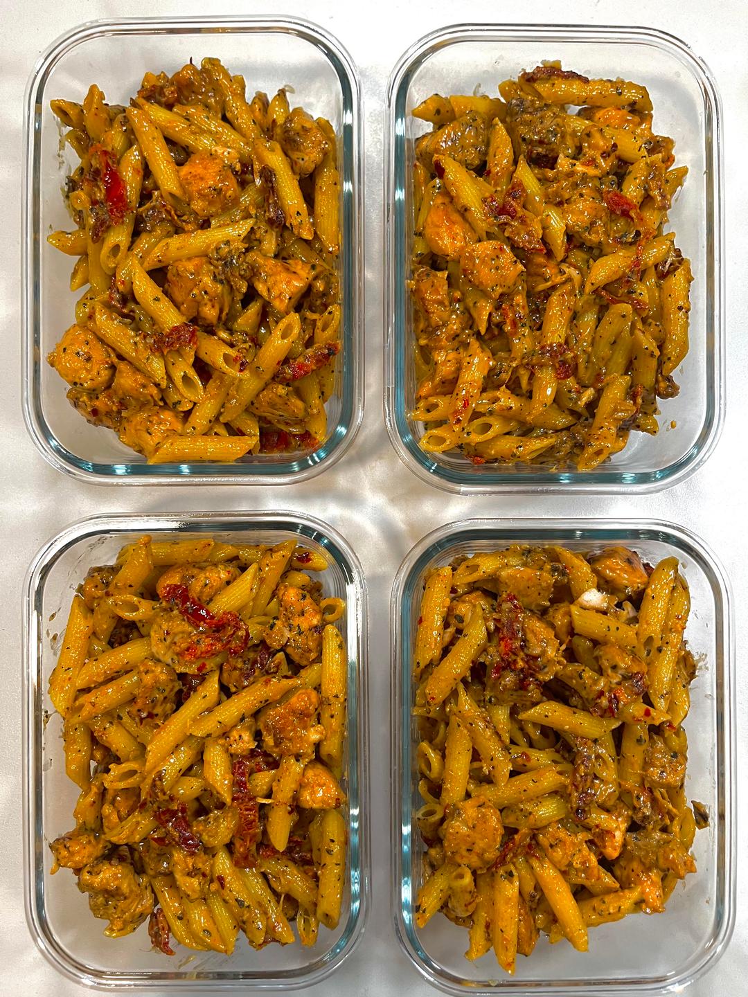 Four prepared servings of Chicken & Sun-Dried Tomato Pasta