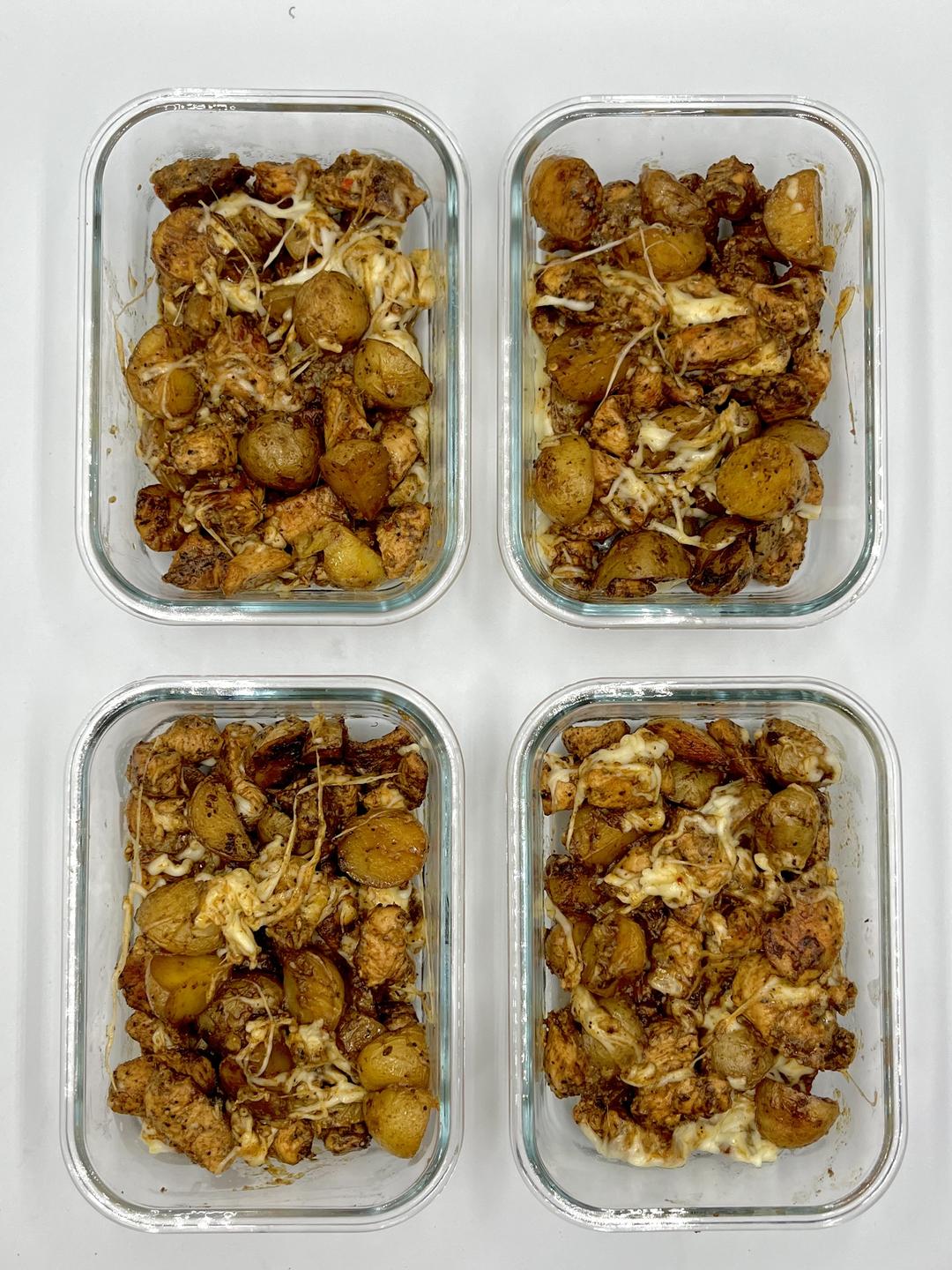 Four prepared servings of Garlic Parmesan Chicken & Potatoes
