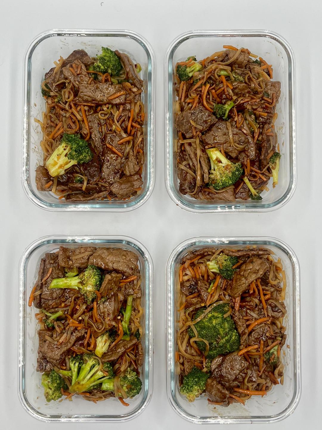 Four prepared servings of Kung Pao Beef With Noodles