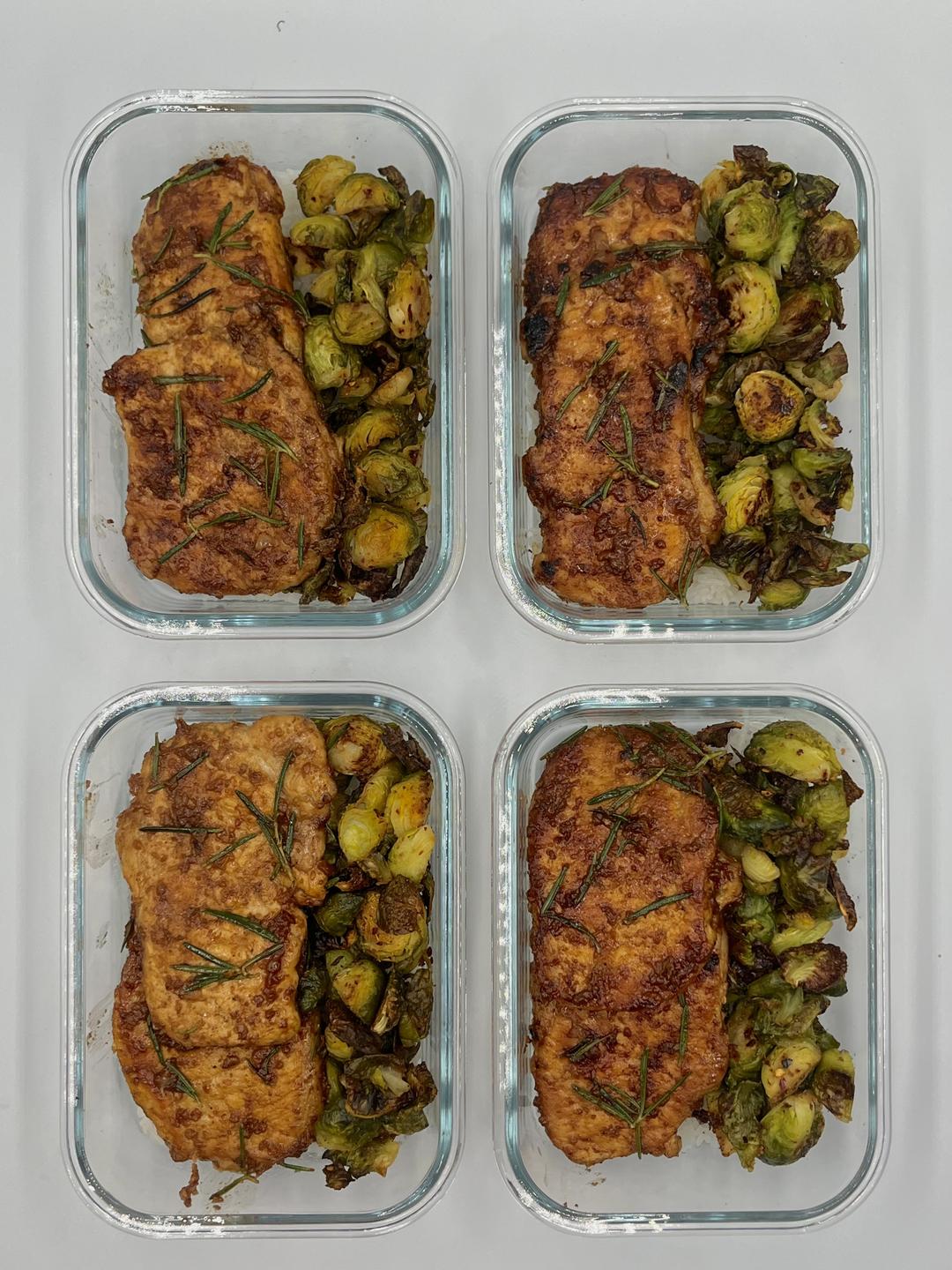 Four prepared servings of Rosemary Garlic Porkchops