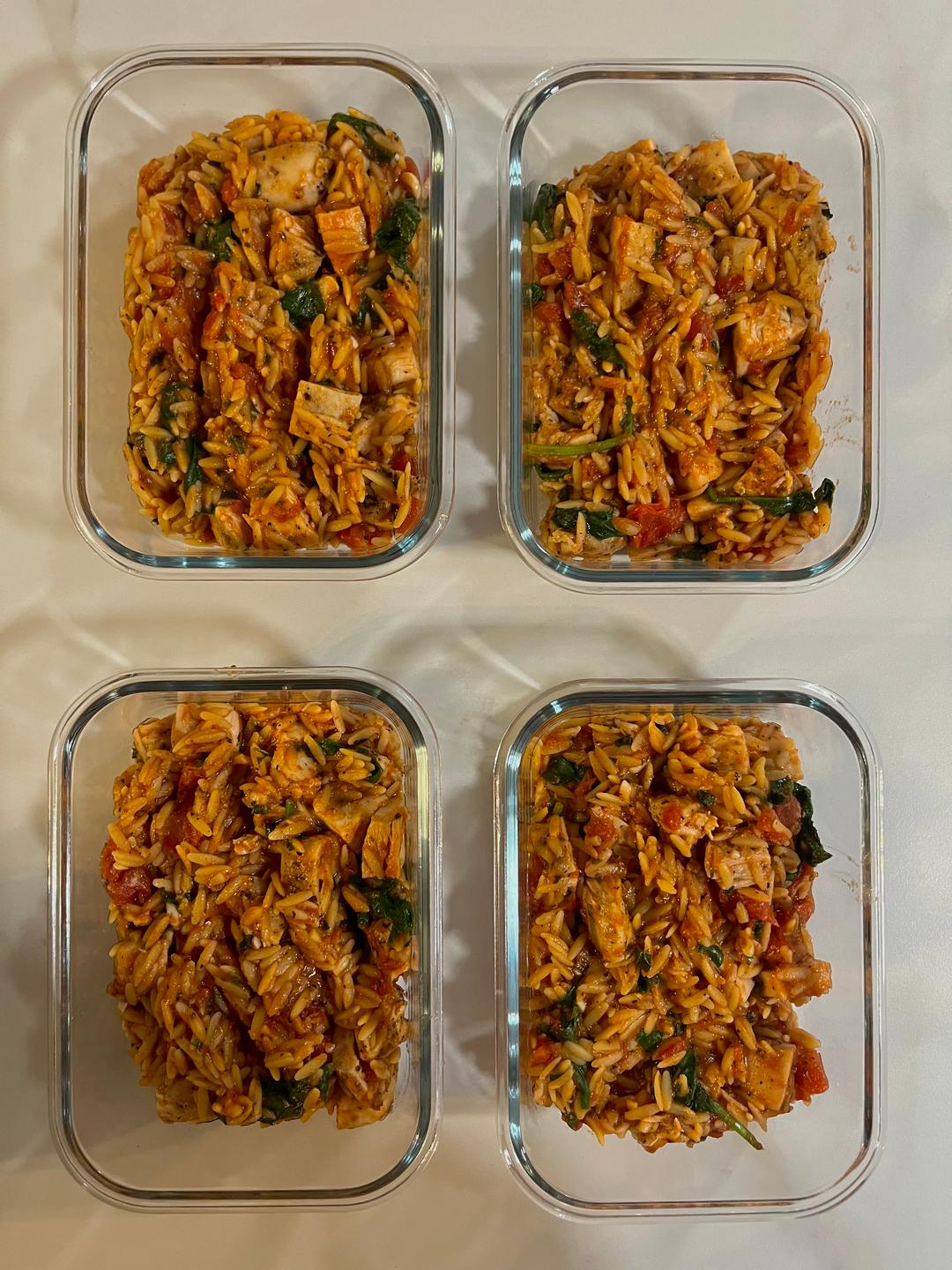 Four prepared servings of Tomato Basil Chicken Orzo