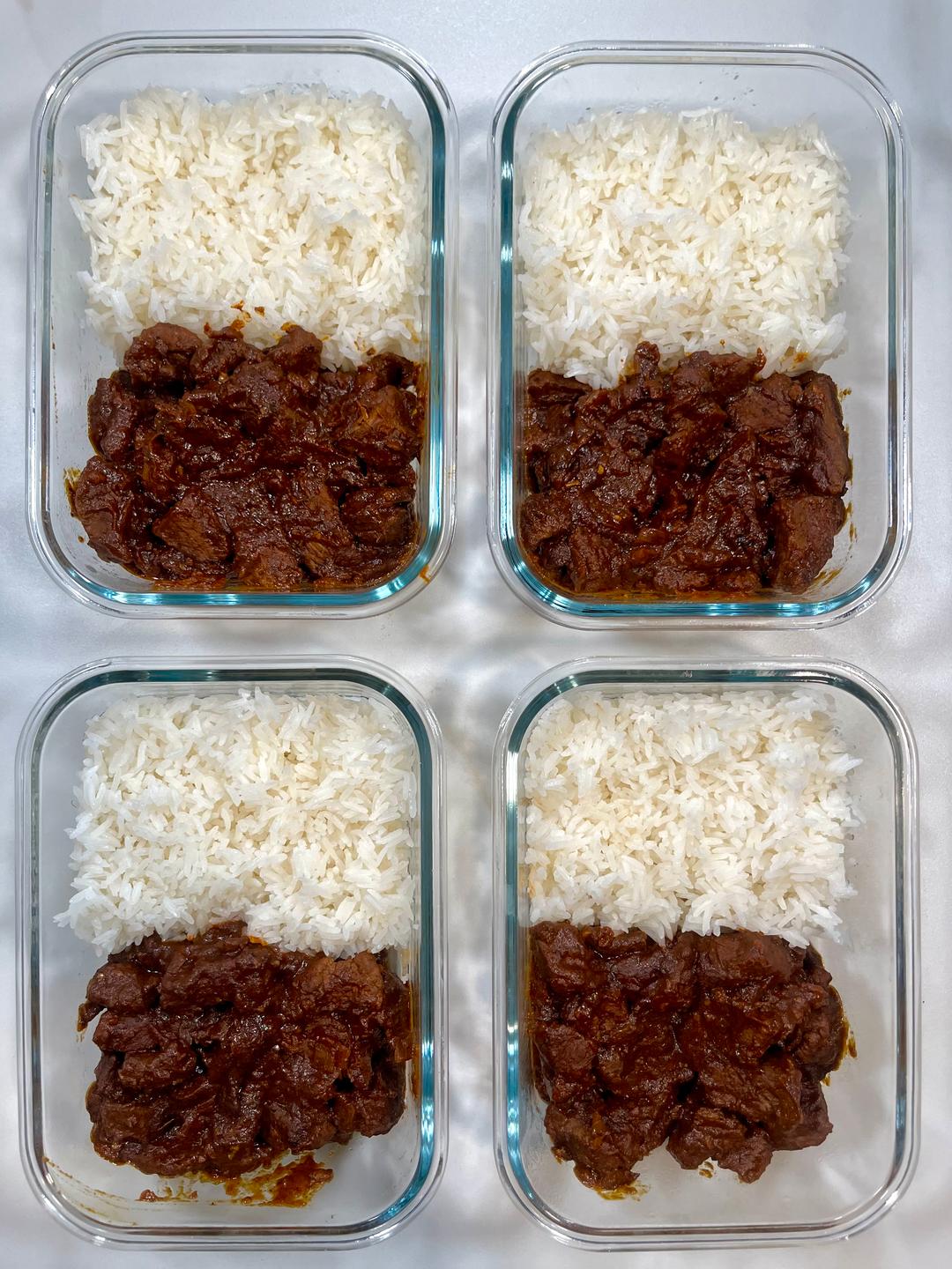 Four prepared servings of Beef Vindaloo