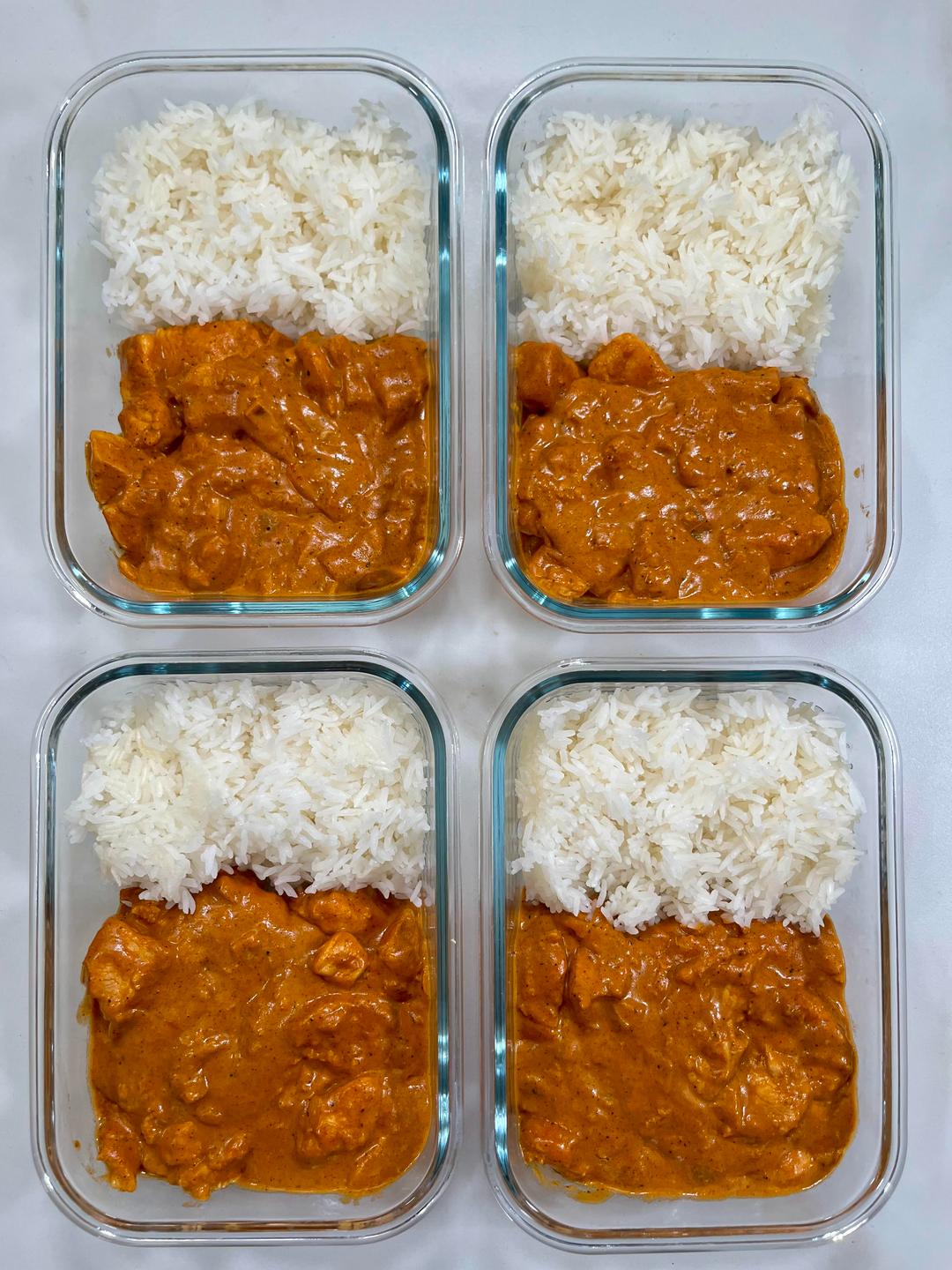 Four prepared servings of Creamy Butter Chicken