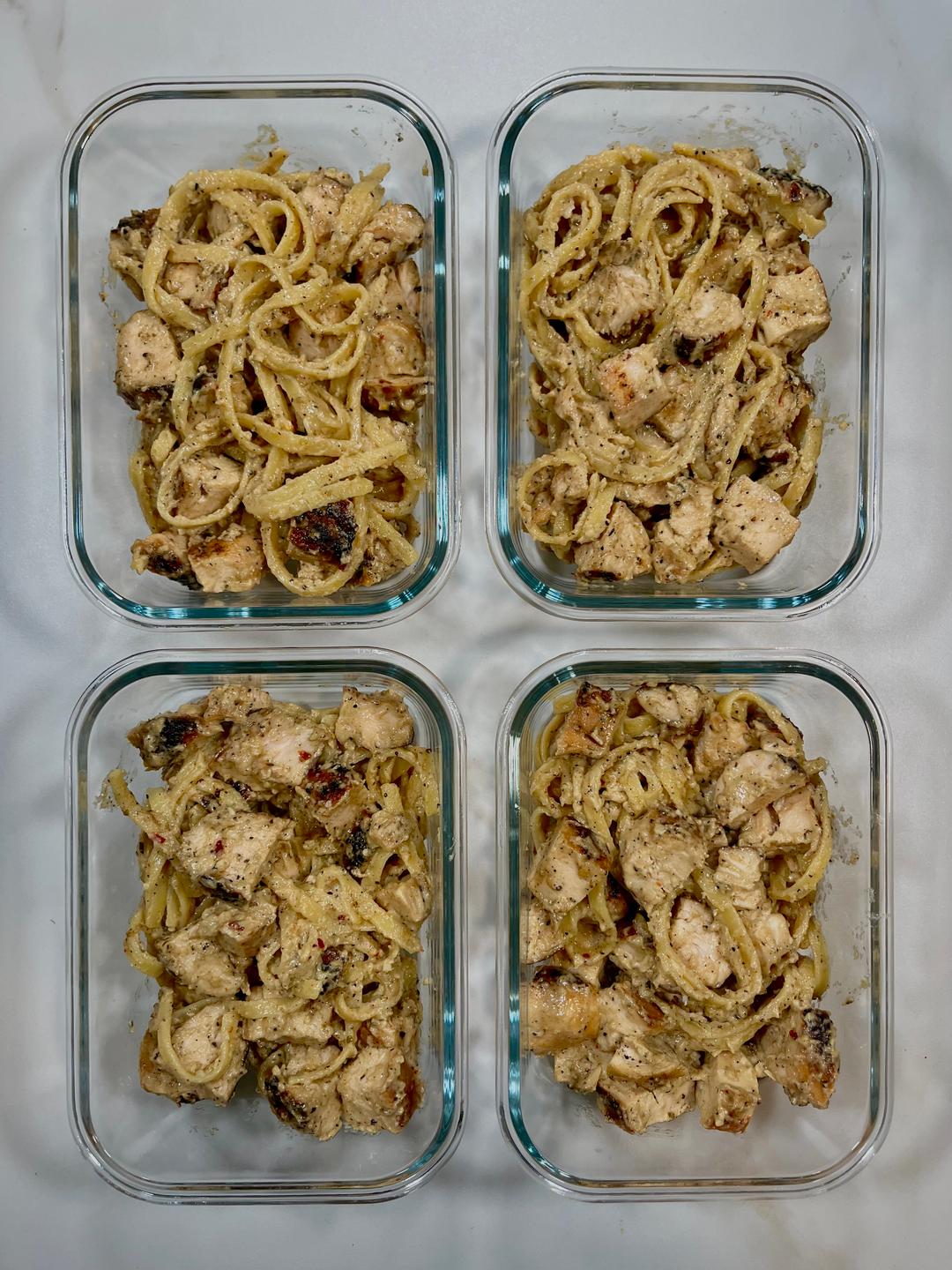 Four prepared servings of Fettuccini Chicken Alfredo