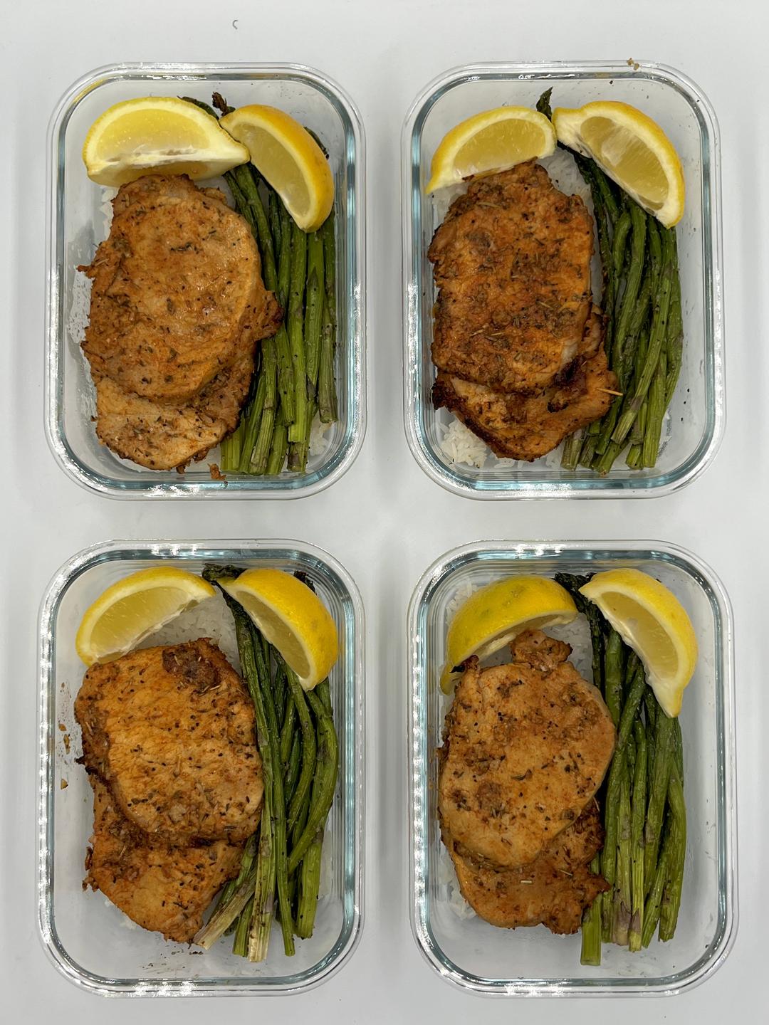 Four prepared servings of Garlic Lemon Herb Porkchops