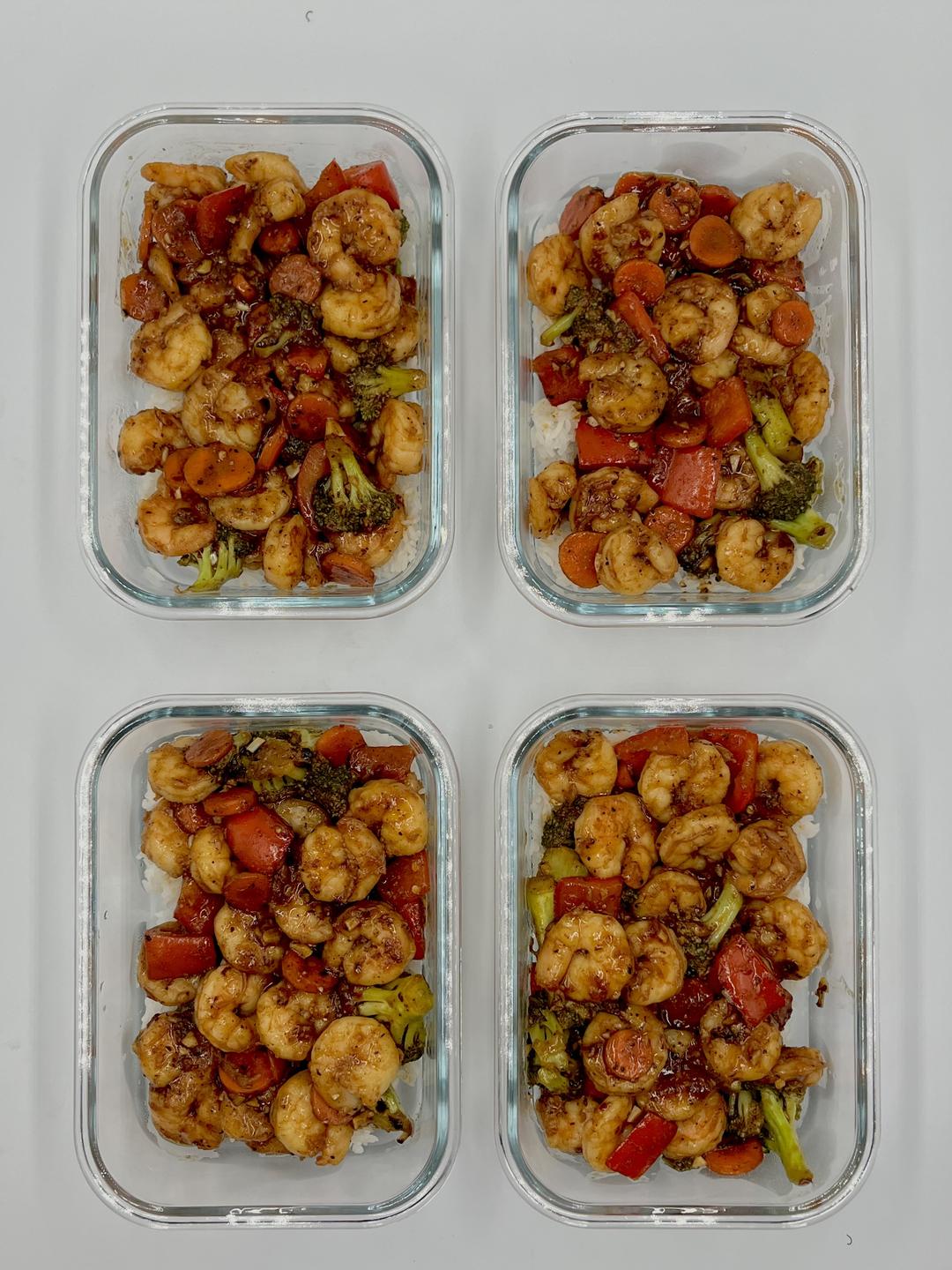 Four prepared servings of Ginger Sesame Shrimp Stir Fry