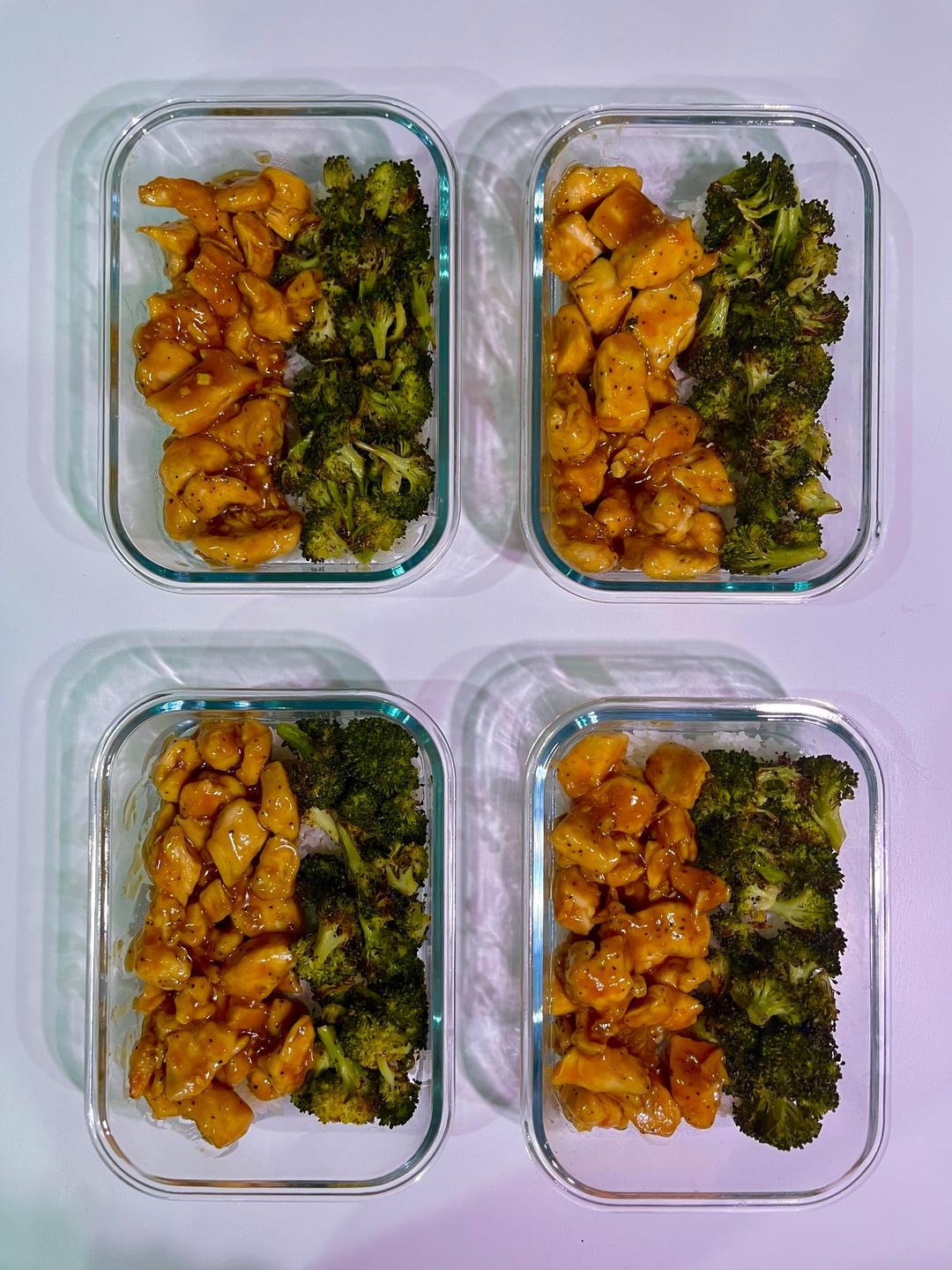 Four prepared servings of Orange Chicken Bowls