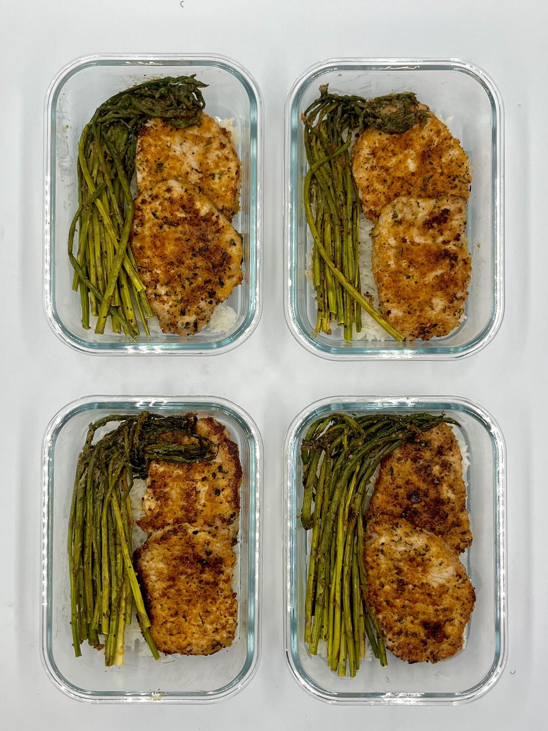 Four prepared servings of Parmesan-Crusted Porkchops