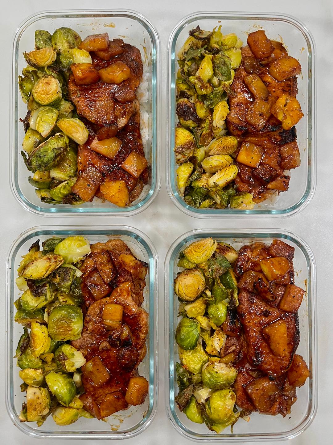 Four prepared servings of Caramelized Pineapple Porkchops