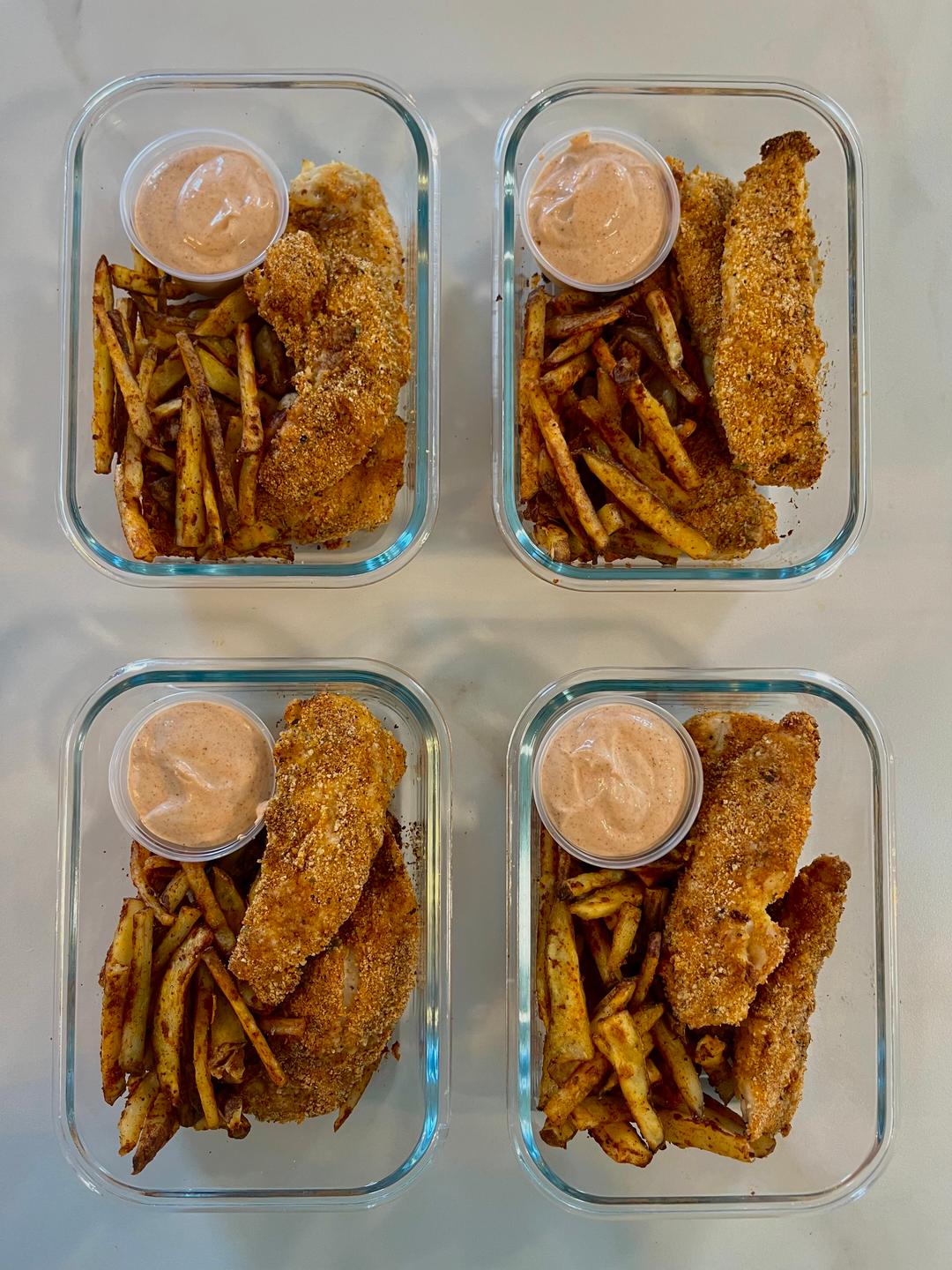 Four prepared servings of Raising Cane’s Chicken & Fries