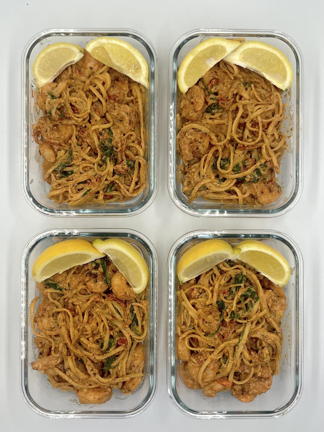 Four prepared servings of Sun-Dried Tomato Shrimp Linguine