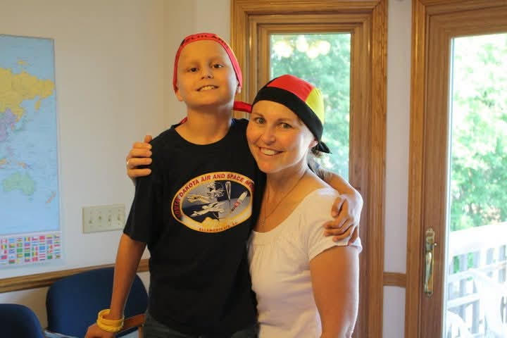 Bryan with his mom during childhood cancer treatment