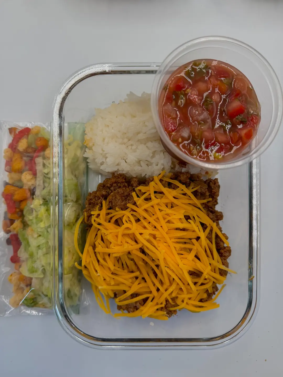 Four prepared servings of Deconstructed Taco Bowls