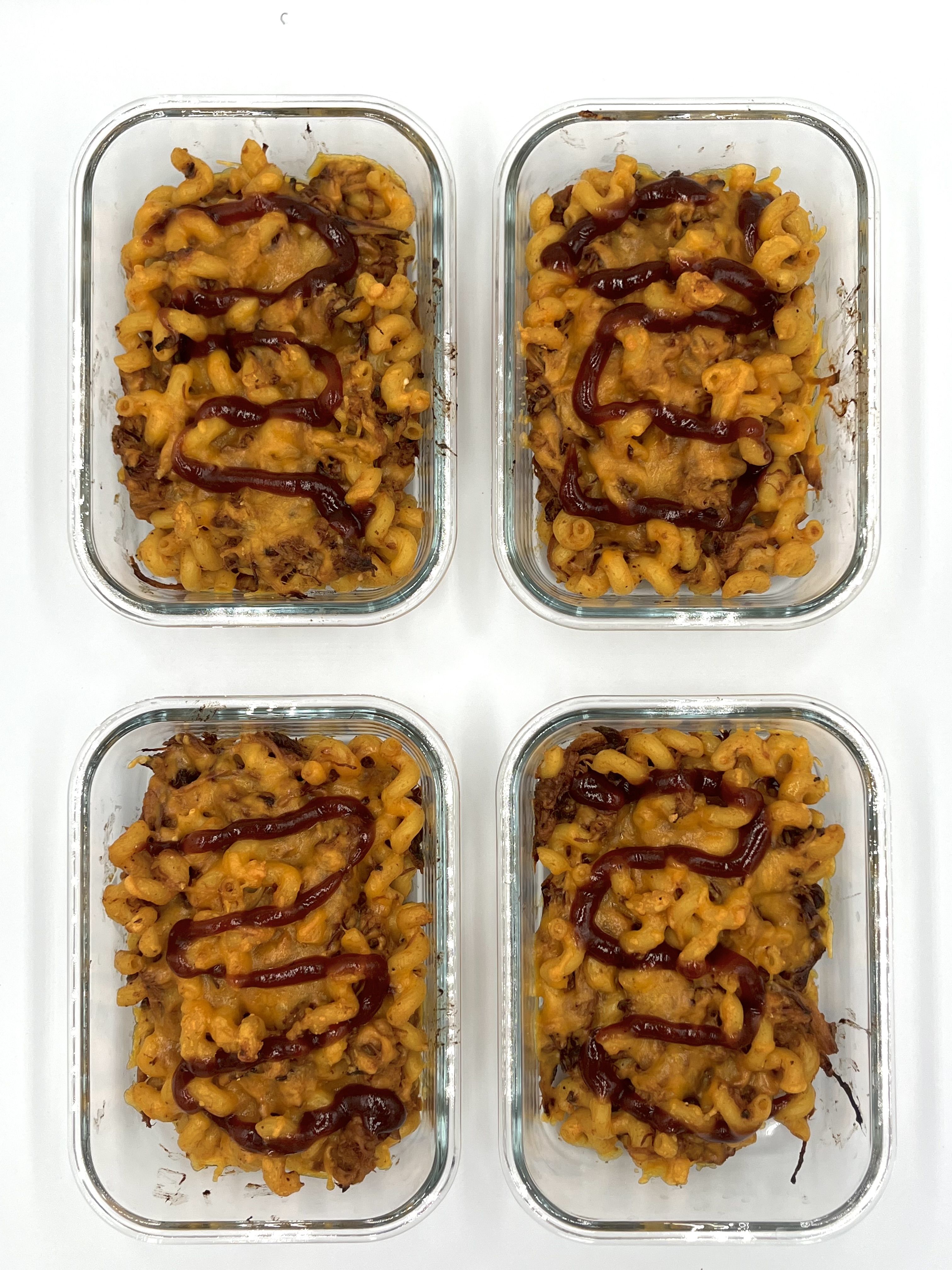 Four prepared servings of BBQ Pulled Pork Mac & Cheese