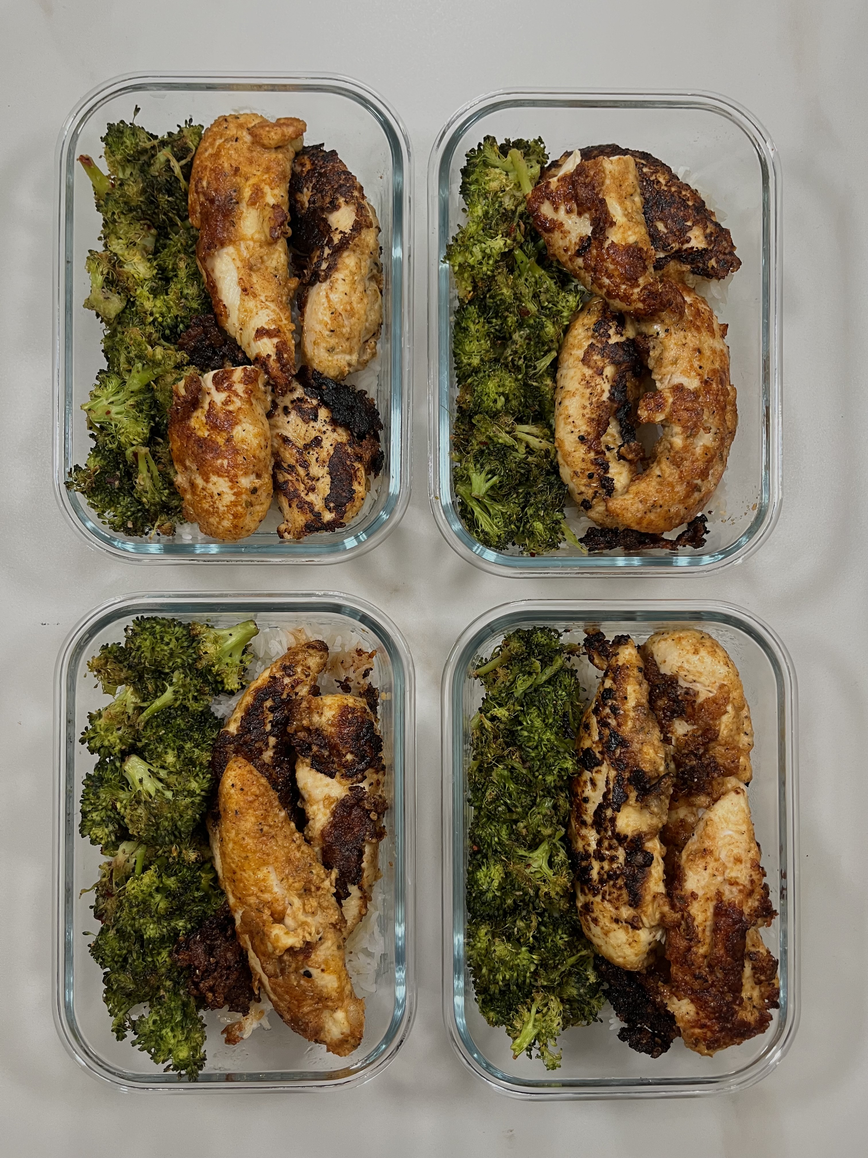Four prepared servings of Garlic Parmesan Chicken