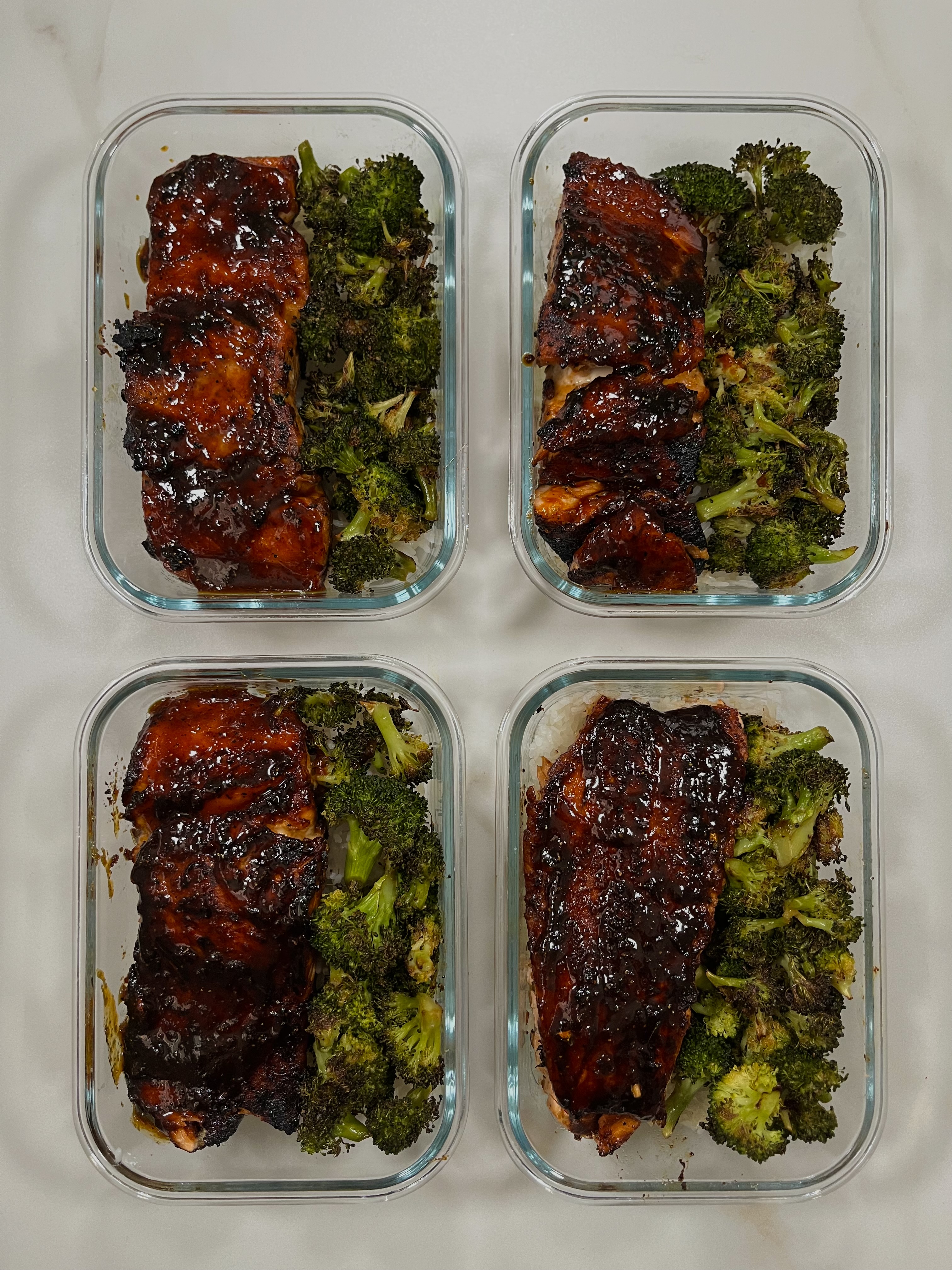 Four prepared servings of Honey Sriracha Glazed Salmon