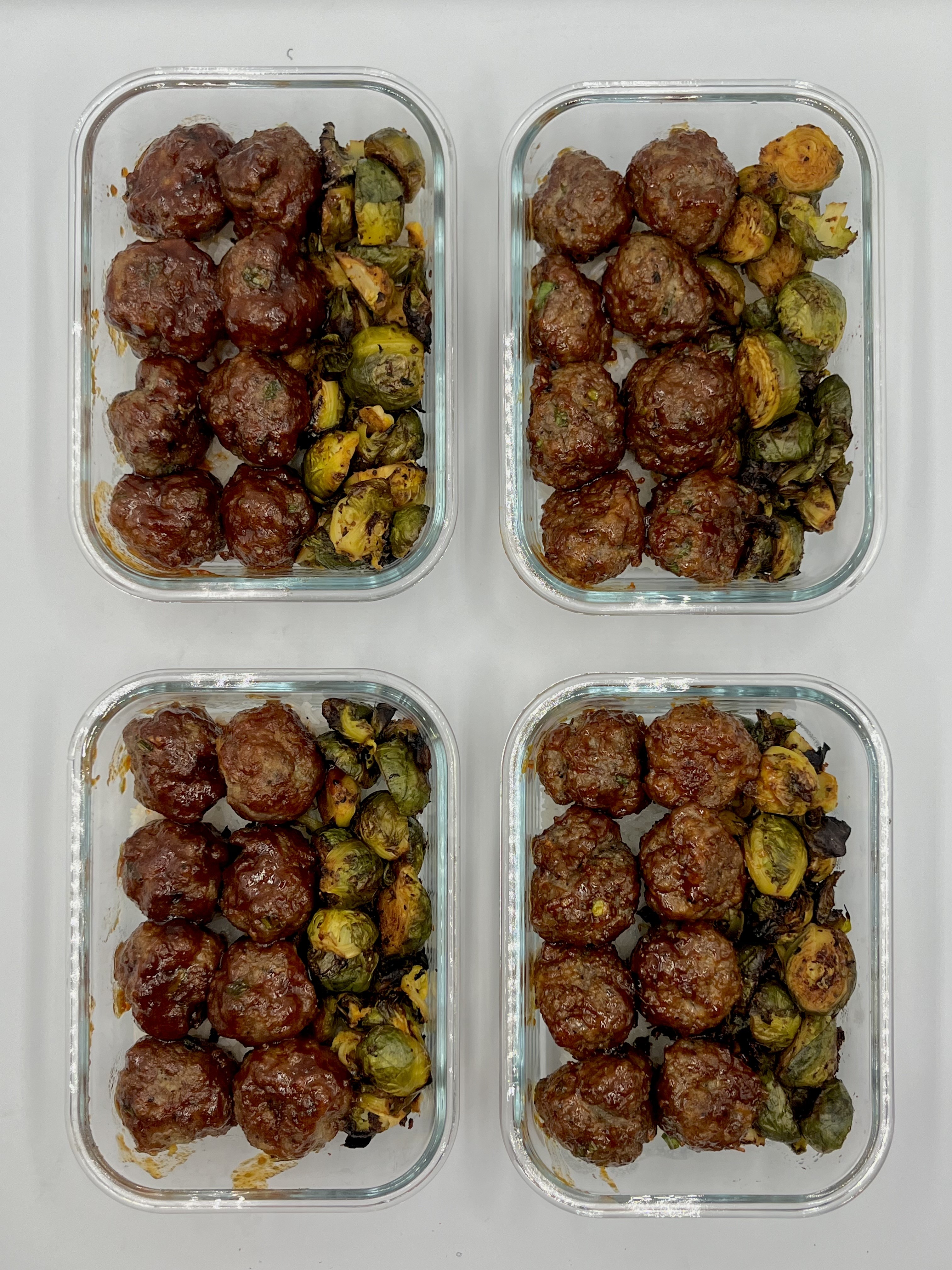 Four prepared servings of Honey Sriracha Meatballs