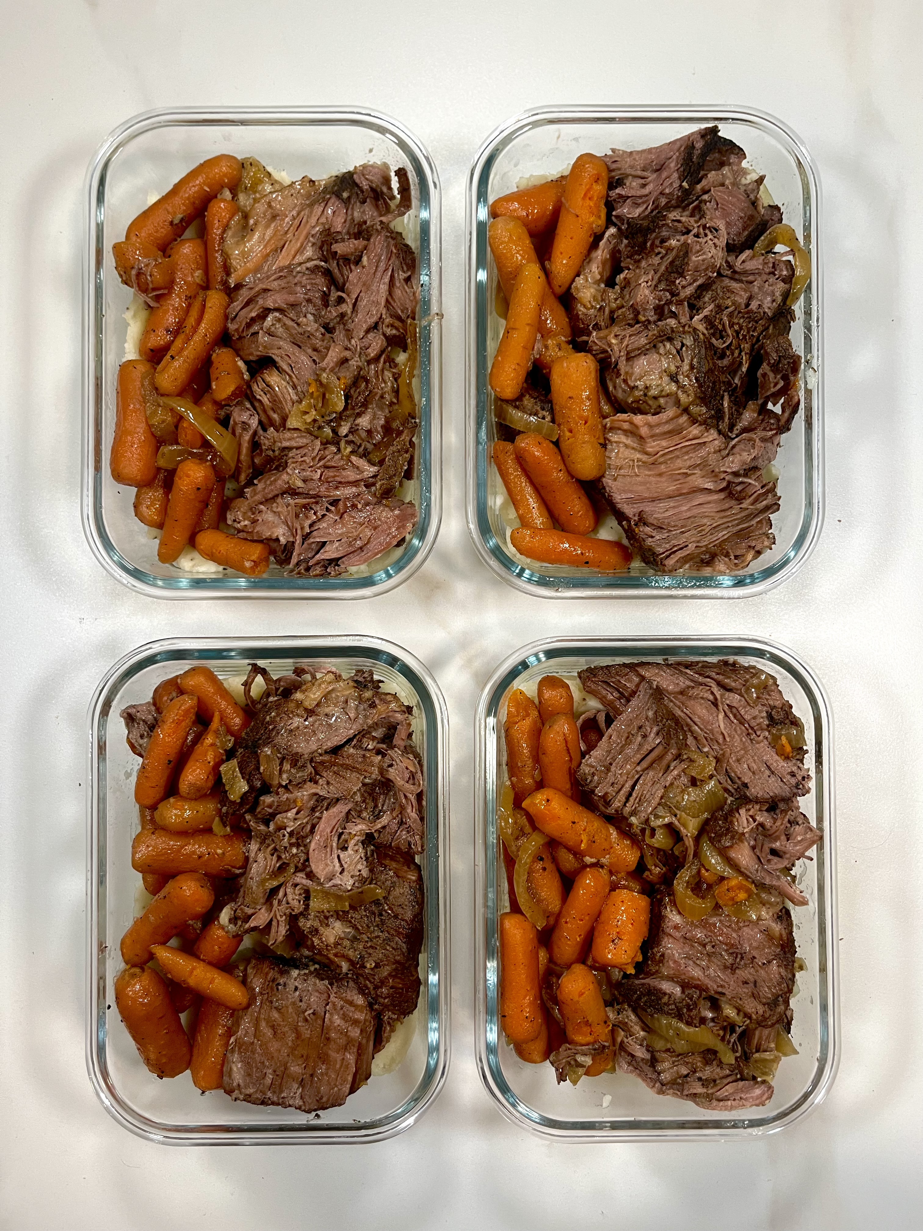 Four prepared servings of Tender Pot Roast