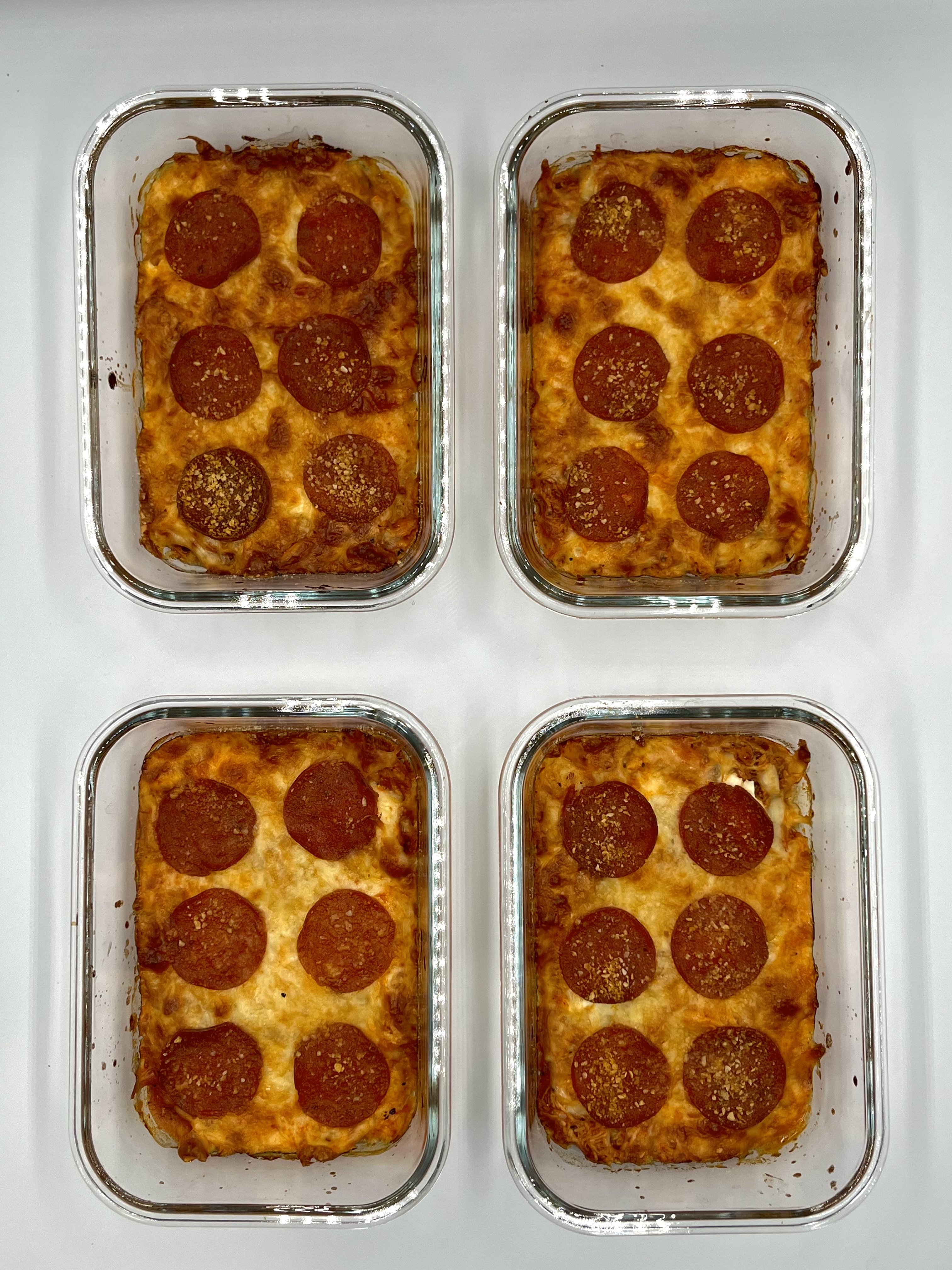 Four prepared servings of Spicy Chicken Pizza Bake